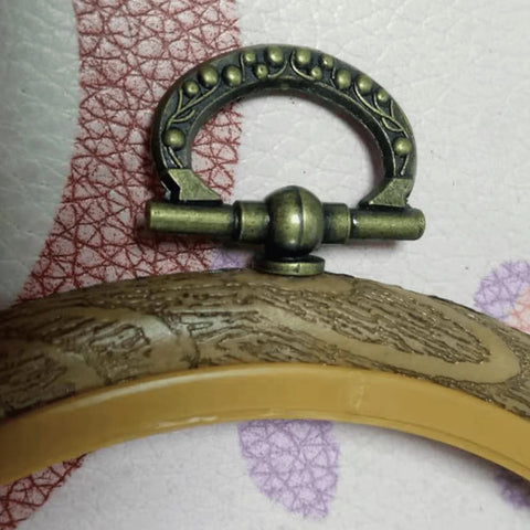 Close-up of antique bronze finish knob from Mini Cabinet Knob Set Ten Pack with self tapping screws for furniture hardware, size 24x27mm.