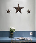 Rustic Metal Barn Star Wall Decor made from recycled iron with vintage finish installed on home wall, includes screws and anchors.