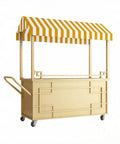 Hustle Ready Portable Mobile Vendor Cart, Dope Flower Display Stand With Heavy Duty Awning, Street Smart Pop Up Food Stall For Market Crafts, Golden Wide Countertop Rack with yellow striped awning.