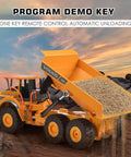 Volvo Authorized RC Dump Truck Toy For Kids unloading sand on rocky terrain with remote control feature visible