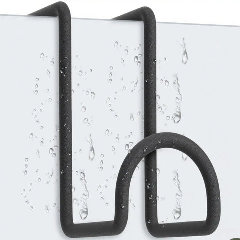 Close-up of 8 Pack 4 Inch Heavy Duty Metal Tack Hooks Over Rail Bridle Rack with water droplets, showing durability.