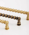 Antique Brass Ball Drawer Pulls, Solid Brass Cabinet Handles With 3.0 Inch Hole Centers in brushed brass finish, side view