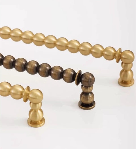 Antique Brass Ball Drawer Pulls, Solid Brass Cabinet Handles With 3.0 Inch Hole Centers in brushed brass finish, side view