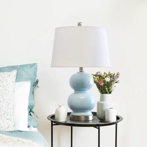 Cool Stacked Stone Double Gourd Ceramic Lamp In Light Blue With White Fabric Shade And Chrome Accents On Table
