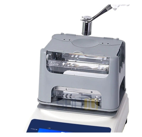 Professional Digital Density Meter For Straight Up Gold Purity Testing And Platinum Jewelry Analysis Rock Solid Lab Grade Assay Checker Tool To Verify Real Deal White Gold Authenticity Fast with clear gray casing.