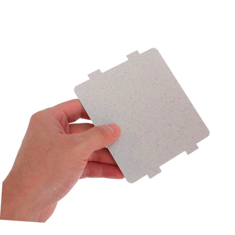 Hand holding 10 Pack High Temperature Mica Sheets For Microwave Ovens Heat Resistant Waveguide Cover And Insulation Shield Easy To Install