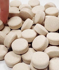 Hand selecting tablets from a pile with logo, 180 Tabs Emergency Food Supply, 15 Day Survival Meals, Gluten Free Non GMO MRE Style.