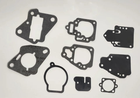 Carburetor Repair Rebuild Kit For Mercury And Mariner 2-Stroke Outboard Engines 10-25HP Part No 1395-8237072 shown with gaskets.