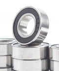 Close-up of Ten Pack 8x16x5 mm ABEC-7 RC Car Bearings With 2RS Sealed Black Finish stacked for hobby trucks and buggies.