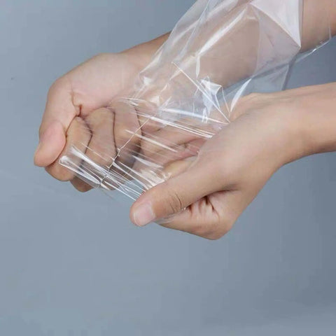 5x7 Inch Shrink Wrap Bags 200 Pcs Pack For Crafting Gift Wrapping And Food Prep Clear Bags You Can Cut To Fit And Seal With A Heat Gun High Shrinkage For Scratch Protection And Tight Compact Packs, clear PVC bag on hands