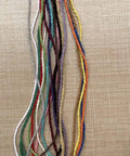 Macrame Cord 1.5mm Cotton String Rope For DIY Crafts 109 Yards With 35 Color Options shown in various bright colors on a surface