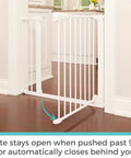 36 Inch Tall Auto Close Baby Gate With Door For Doorways Pressure Mounted Fits 29.75 To 40.5 Inch Openings White Swing Gate That Opens In Either Direction Easy One Hand Operation Kid Safe And Secure installed in doorway