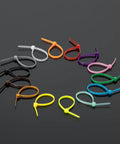 Colorful Zip Ties 1400 Pack 4 Inch Multicolor Plastic Wire Ties Assortment arranged on a dark surface