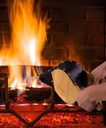 Heavy Duty Fireplace Bellows And Large Wood Fire Blower Crafted From Rock Hard Heat Resistant Leather, smooth hand pump in use near roaring fire.