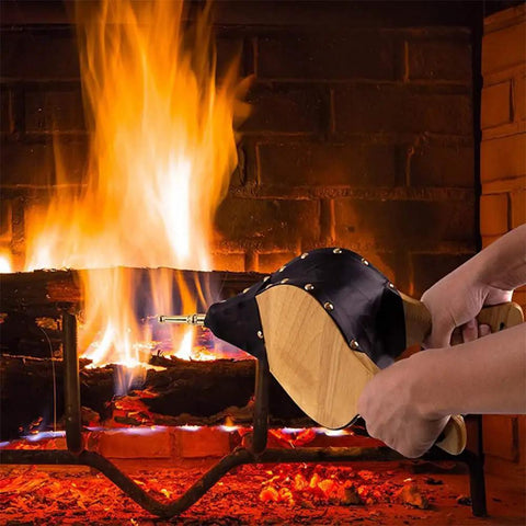 Heavy Duty Fireplace Bellows And Large Wood Fire Blower Crafted From Rock Hard Heat Resistant Leather, smooth hand pump in use near roaring fire.