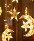 Solar String Lights Outdoor for Ramadan Eid Decor, 138 LED Star Moon Curtain Lights glowing warmly in dark.