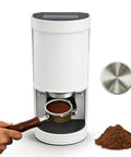 Hassle Free Automatic Coffee Tamper Machine Designed For Home Baristas Featuring Adjustable Pressure Settings Smooth Stainless Steel Build And Dead Simple Operation For Perfect Espresso Shots Daily with coffee grounds in portafilter.