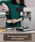 Workhorse Commercial Drip Coffee Maker With 12 Cup Capacity And 74 Ounce Thermal Carafe In Stainless Steel next to a person pouring coffee