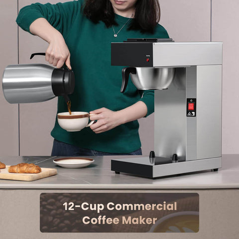 Workhorse Commercial Drip Coffee Maker With 12 Cup Capacity And 74 Ounce Thermal Carafe In Stainless Steel next to a person pouring coffee
