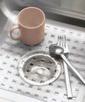 Clear Plastic Sink Grid Protector For Kitchen And Laundry Sinks Open Wire Design 11 By 12 And A Half Inches with Dishes on Top