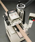 Badass Two Hp Planer Molder With Stand And Power Feed 220 Volt Woodworking Beast featuring cast iron wings and power feed in action