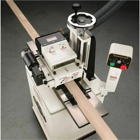 Badass Two Hp Planer Molder With Stand And Power Feed 220 Volt Woodworking Beast featuring cast iron wings and power feed in action