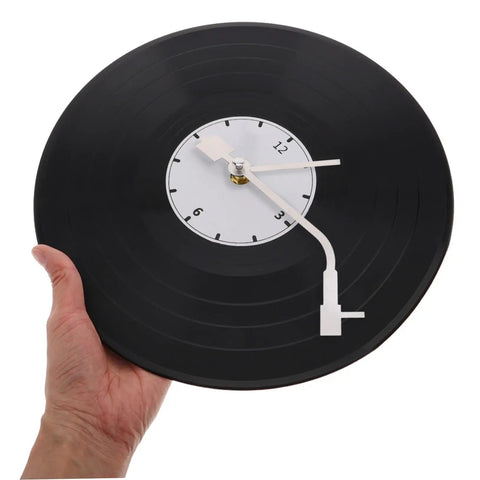 Hand holding vinyl clock showing Vinyl Record Clock Replacement Parts Kit With Movements, Hands, And Long Shafts For Easy DIY Repair