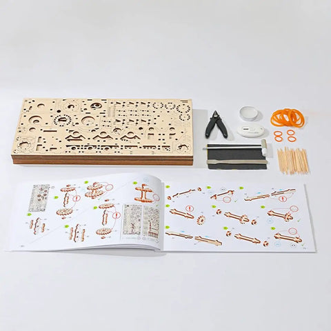 Components and instructions of 3D Wooden Steam Train Building Set For Adults With Wind Up Mechanical System And Track Rubber Band Powered Locomotive Kit.