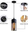 Industrial Farmhouse Pendant Light With Black Finish And Amber Cylinder Shade, showing adjustable cord and E26 lamp holder.