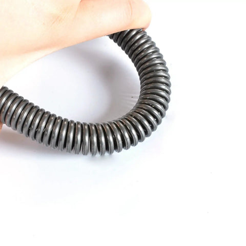 Hand holding a gray and black heavy duty dual hook tension spring, showcasing pack of 2 with 3mm wire and 18-20mm outer diameter.