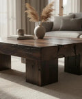 Pro Grade Black Bogwood Reactive Water Based Interior Wood Stain In A Heavy Duty 55 Gallon Drum used on rustic coffee table surface.