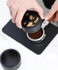 Game Changing Wdt Espresso Distribution Tool With Ten Precision Stainless Steel Needles Tailored For 51mm 53mm 54mm And 58mm Portafilters in use over coffee grounds.