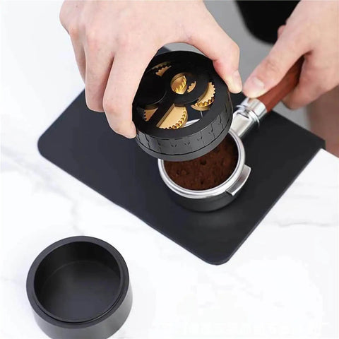 Game Changing Wdt Espresso Distribution Tool With Ten Precision Stainless Steel Needles Tailored For 51mm 53mm 54mm And 58mm Portafilters in use over coffee grounds.