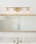Gold Vanity Lights 4 Light Modern Bathroom Fixtures With Gourd Glass Shades above a mirror in a bathroom setting.