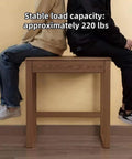 Two people sitting on the Top Shelf Solid Rubberwood Dual Gaming Desk With Built In Pine Drawers, highlighting its ample knee room.