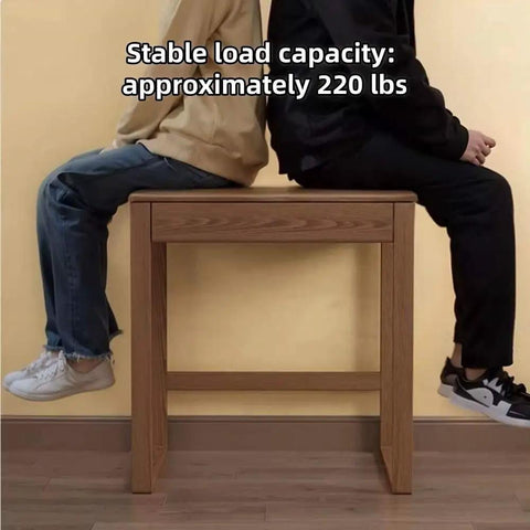 Two people sitting on the Top Shelf Solid Rubberwood Dual Gaming Desk With Built In Pine Drawers, highlighting its ample knee room.