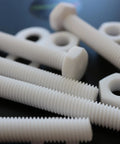 Top Shelf Natural PTFE Hex Head Bolts M10 X 100mm Screw Set with nuts and washers on a dark background.
