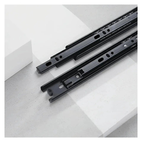 Rock Solid Triple Section Ball Bearing Drawer Slides Built To Last With Cold Rolled Steel, showcasing smooth steel slides lying on a surface.