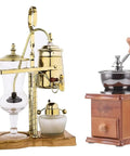 Top Shelf Siphon Coffee Maker Syphon Glass Brewer 4 Cup with gold accents and ergonomic handle next to a wooden coffee grinder.