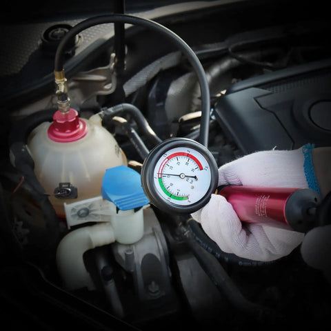 Cooling System Radiator Coolant Pressure Leak Tester Manual Hand Pump Gauge with gauge reading and reservoir in car engine.