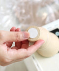 Person applying Tough As Nails 40 Pack Furniture Sliders Nail On Chair Leg Protectors For Wood And Hardwood Floors to chair.