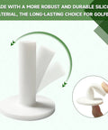 White rubber stand from 16 Piece Golf Tee Set With Rubber Stands And Bamboo Tees For Mats Tee Up At Indoor Driving Range And Golf Simulators Universal Tees For Artificial Turf Mats With Adjustable Heights For Driver Wood Or Hybrid displayed with side view and finger for scale.