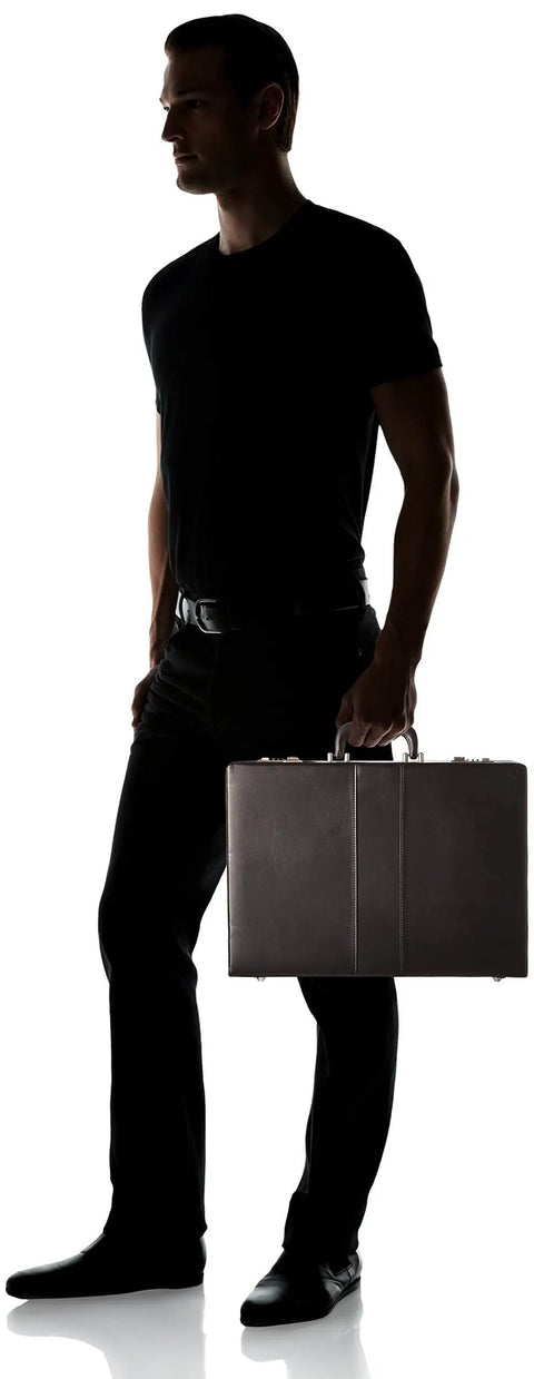 Silhouette of man holding Premium Black Expanding Document Portfolio With Secure Combination Lock And Roomy File Compartments.