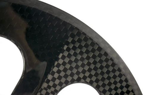 Close-up of Carbon Fixed Gear Wheelset For Track And Street Ride Front 70mm Rear 88mm Clincher 12k Glossy Finish Toray T700