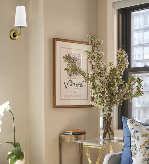 Gold Fabric Shade Wall Sconce Set of 2 - Modern 1-Light Hardwired Brass Wall Lamps with Brushed Gold Finish beside a beige wall