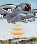 Mini Drone For Kids Super Easy To Fly With 3D Flips And 360 Degree Rotation, hovering above rocky terrain