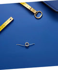 Bulk 20 Pc Torsion Spring Kit For Trash Can Lids With Tiny Iron Nickel Coils, Super Simple Diy Repair And Silent Operation Perfect For Home Maintenance Needs. silver torsion spring on blue background with measuring tape