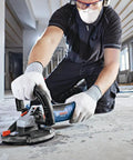 Worker using 5 Inch Diamond Cup Grinding Wheel For Concrete With Double Row Segments, optimized bond, in concrete surface prep
