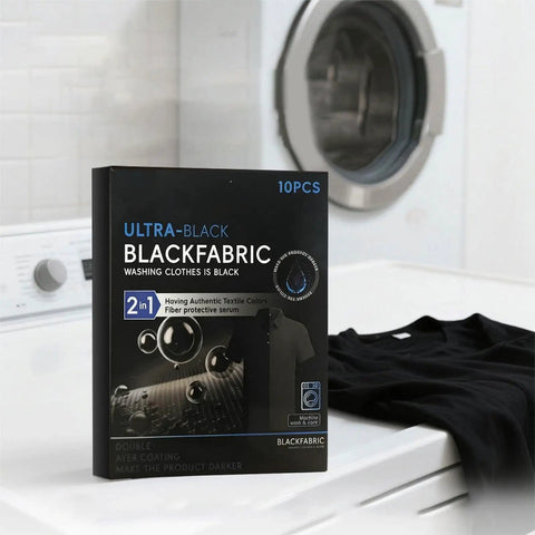 Black Fabric Dye Sheets 10 Pack That Restores Faded Clothes To Rich Black In Every Wash next to washing machine and shirt