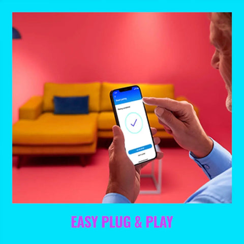 Person using phone app to control Squire Smart Table Lamp With Motion Activation And Color Changing LEDs Portable Desk Light